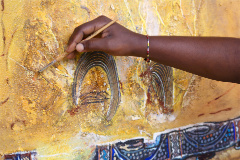 hand with paintbrush