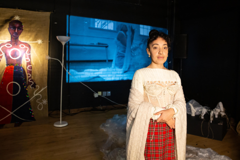 artist Ffion Campbell-Davies with art video in background